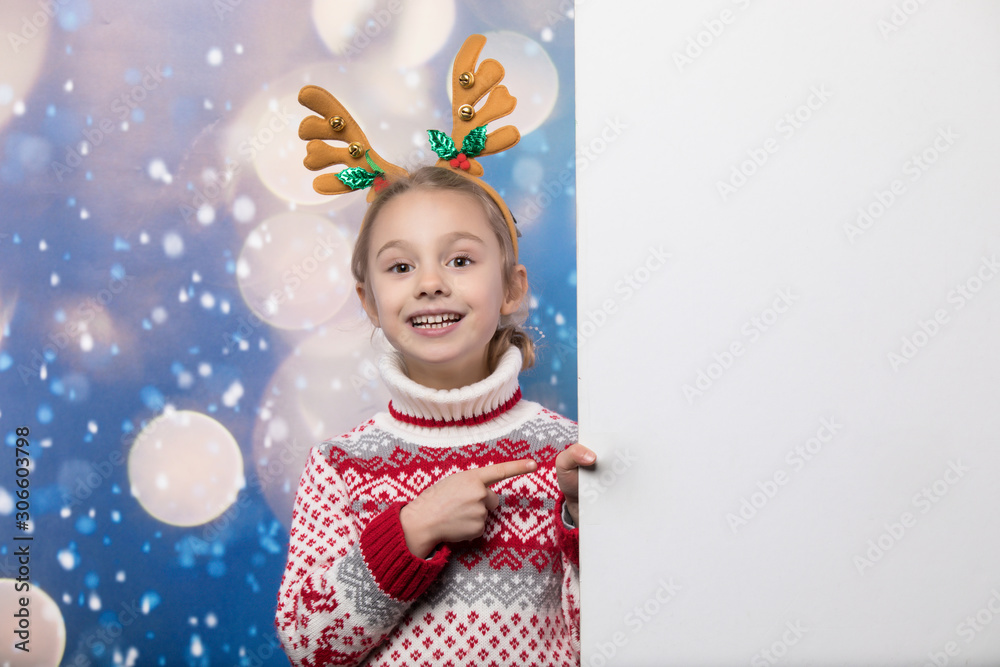 Smiling girl in the winter look. Christmas concept.