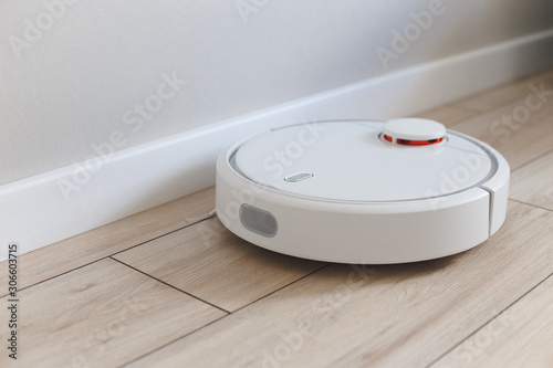 Home vacuum cleaning robot cleaning the room