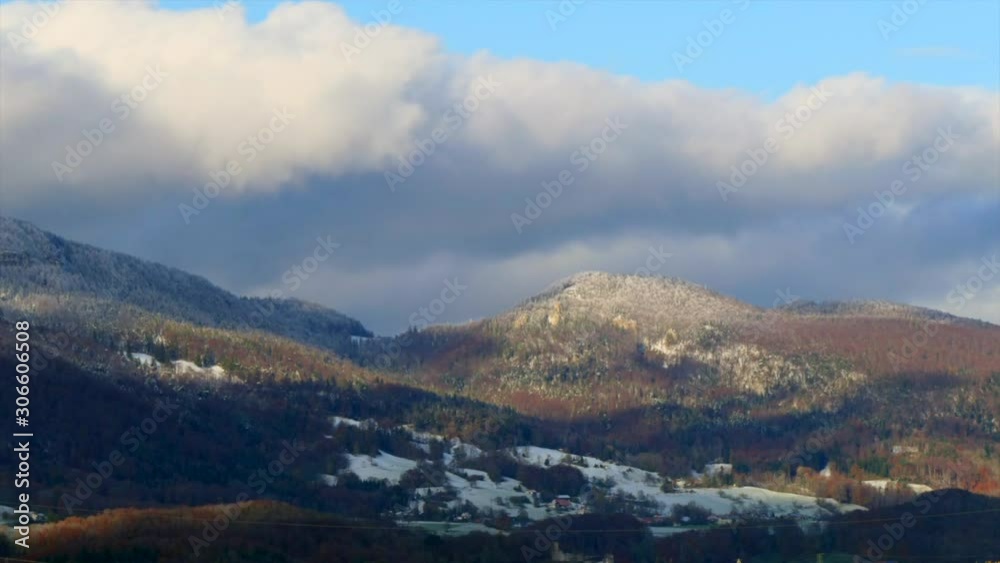Timelapse of a mountain, on which clouds pass quickly, with a view of a tahl which is flooded with sunlight at the end of the video. Timelapse of a mountain, on which clouds pass quickly, with a view of a tahl which is flooded with sunlight at the end of the video.