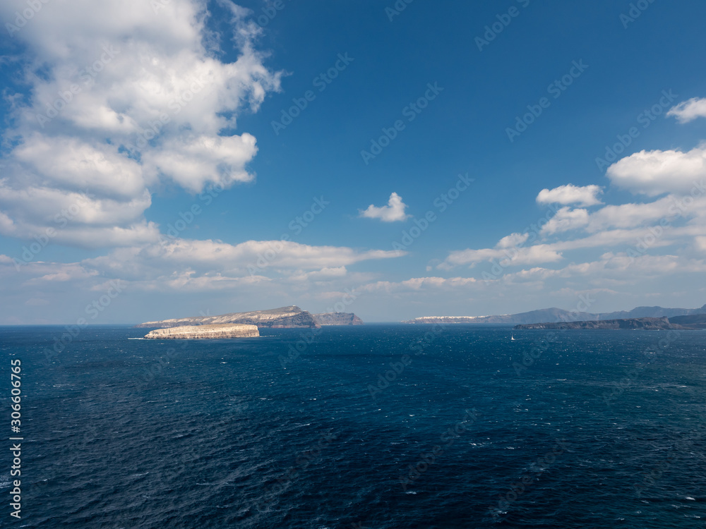 Santorini Island Rock Shore Sunny sky clouds Sea