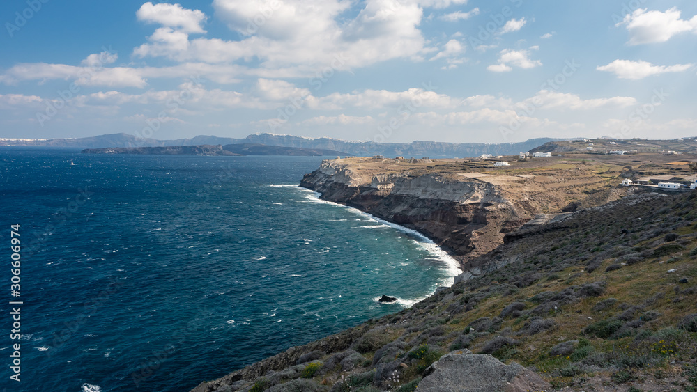 Santorini Island Rock Shore Sunny sky clouds Sea Santorini Island Rock Shore Sunny sky clouds Sea
