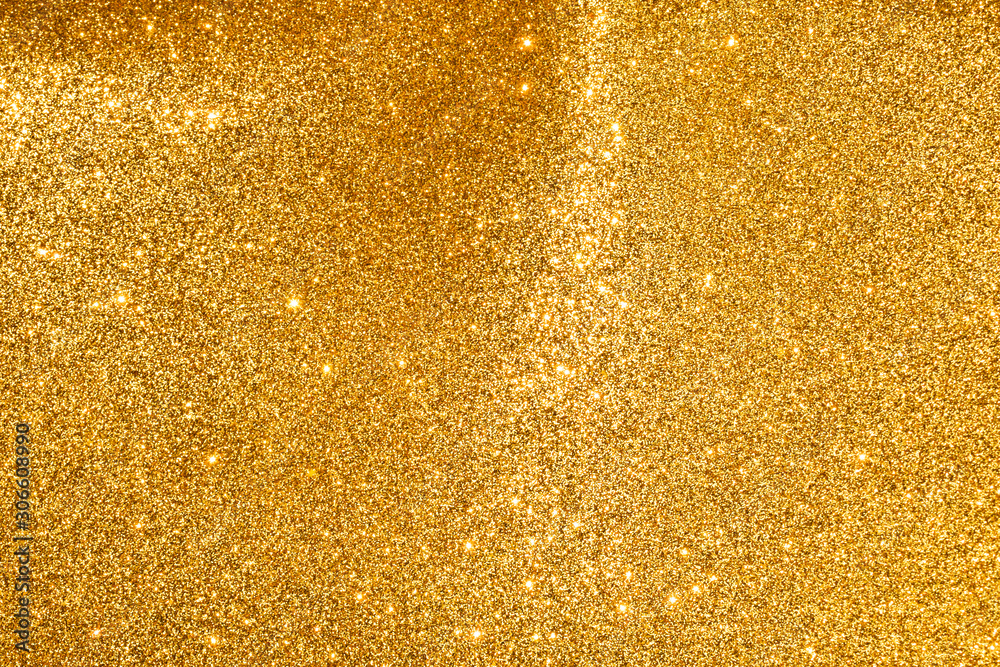 sparkles of golden glitter abstract background	