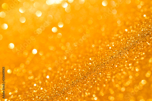 sparkles of golden glitter abstract background	