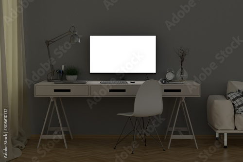 Bright computer monitor at night in the studio or at home workplace. Clipping path around display. 3d illustration