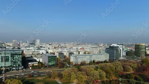 Aerial of dense traffic on the Aleja Armii Ludowej Highway through air polluted Warsaw City, Poland, east-europe photo