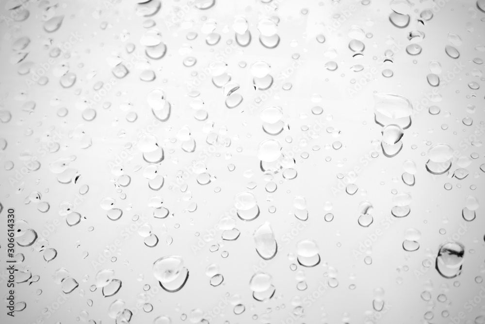 Raindrop water dew drop on glass wet white gray blue background. Raindrop water dew drop on glass wet white gray blue background.