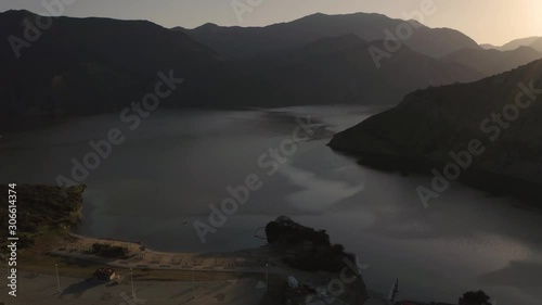 Predawn aerial view of Pyramid Lake, a recreational destination formed by Pyramid Dam on Piru Creek, San Emigdio Mountains, near Castaic, SoCA. West Branch California Aqueduct, State Water Project. photo