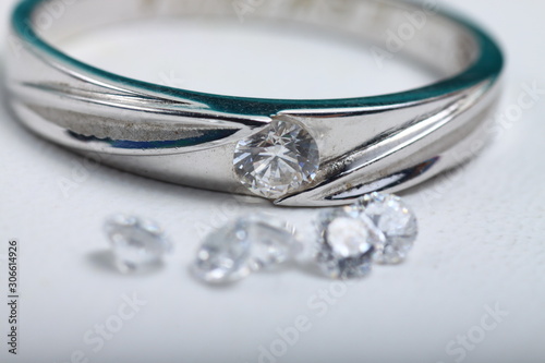 Close up shoot of an white gold engagement ring with diamonds on an isolated white background