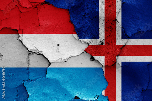 flags of Luxembourg and Iceland painted on cracked wall