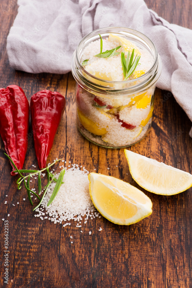Preserved Lemons with salt on a wooden board