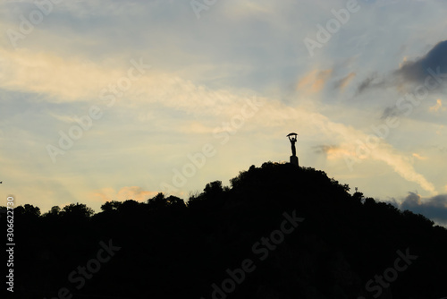 sunset with liberty statue on gellert hill budapest