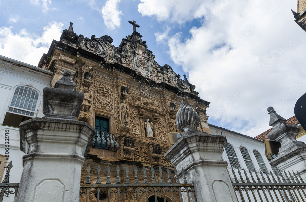 Bright sunny view of the historic tourist center of Pelourinho, Salvador da Bahia, Brazil featuring colorful colonial architecture on a broad cobblestone hill