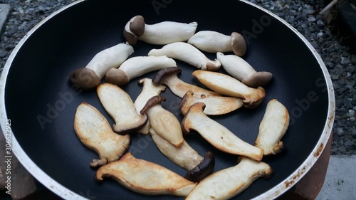 frying pan with sausage and mushrooms
