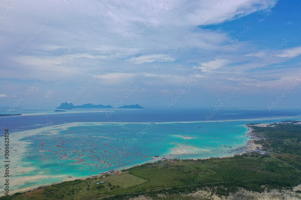 Aerial view partial part of Semporna island with blue ocean and coral reef in Malaysia, Borneo.