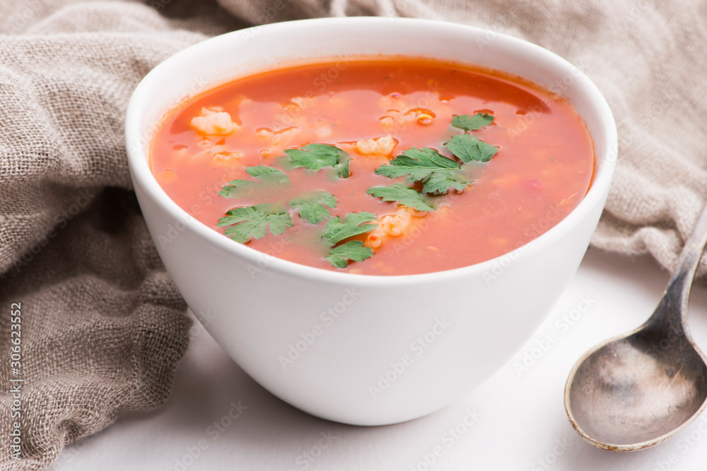 Tomato soup with rice decorated with parsley