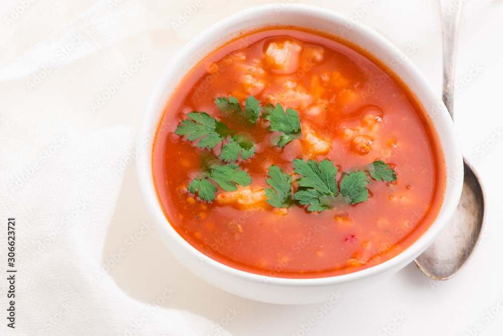 Tomato soup with rice decorated with parsley