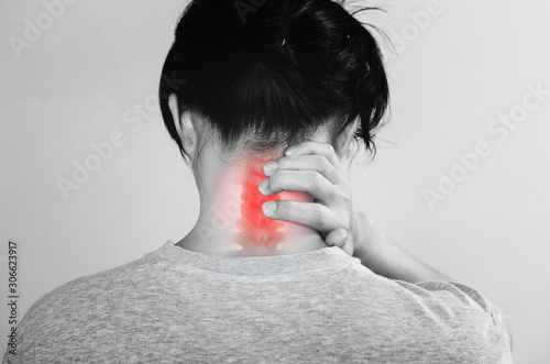 Neck Pain. a man touching neck at pain point