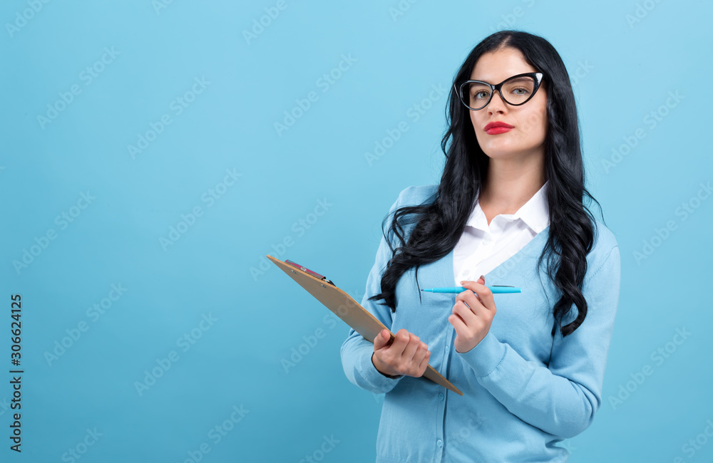 Office woman with a clipboard on a blue background Office woman with a clipboard on a blue background