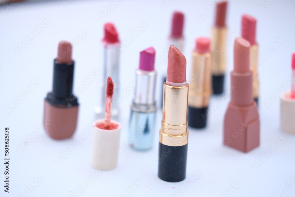 lipstick and nail polish on white background lipstick and nail polish on white background
