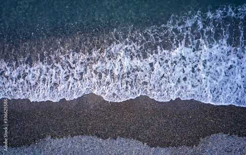 Fototapeta Naklejka Na Ścianę i Meble -  Aerial image of pebble beach. Camera looks straight down