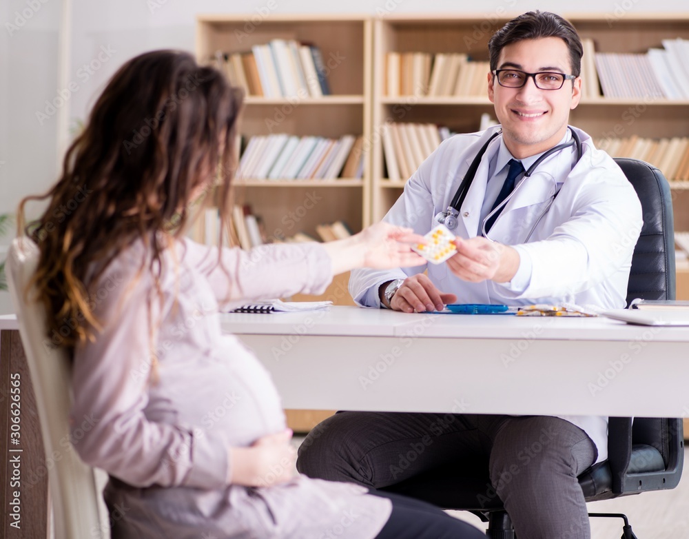 Pregnant woman visiting doctor for consultation Pregnant woman visiting doctor for consultation