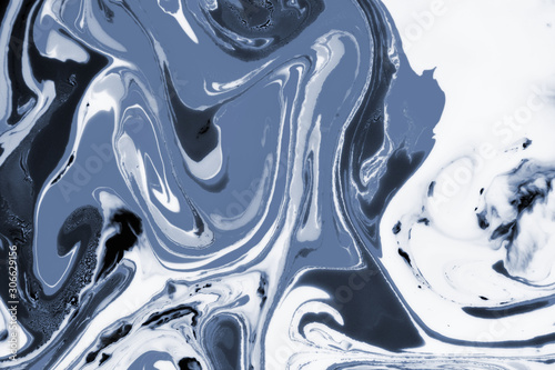 Modern painting in the technique of Ebru and suminagashi. Abstract drawings on water with acrylic paints.Marble liquid texture.