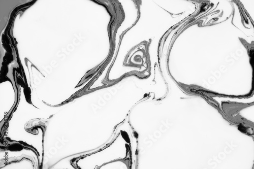 Modern painting in the technique of Ebru and suminagashi. Abstract drawings on water with acrylic paints.Marble liquid texture.