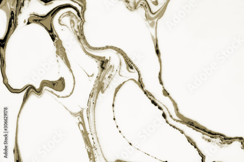 Modern painting in the technique of Ebru and suminagashi. Abstract drawings on water with acrylic paints.Marble liquid texture.