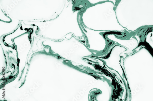 Modern painting in the technique of Ebru and suminagashi. Abstract drawings on water with acrylic paints.Marble liquid texture.