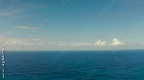 Wallpaper Mural Blue ocean with waves and sky with clouds, seascape top view. Blue sea water with waves against sky. Summer and travel vacation concept. Torontodigital.ca
