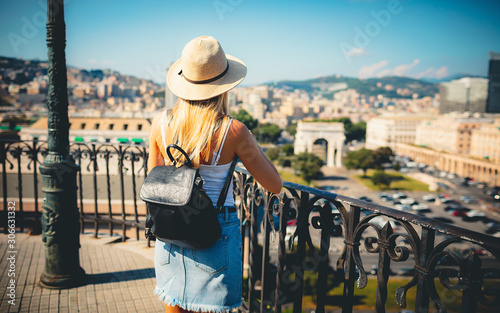 Rome Europe Italia travel summer tourism holiday vacation background - young girl with hat mobile phone and using action camera backpack in hand standing on the hill looking on the cathedral old city