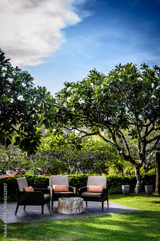 outdoor garden seating in a garden with pillows and many trees outdoor garden seating in a garden with pillows and many trees