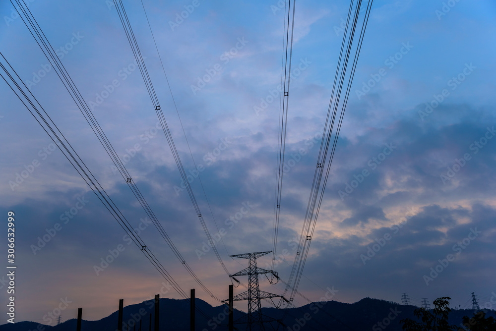 a wide-angle shot on power lines in the sunset sky background in hong kong china
