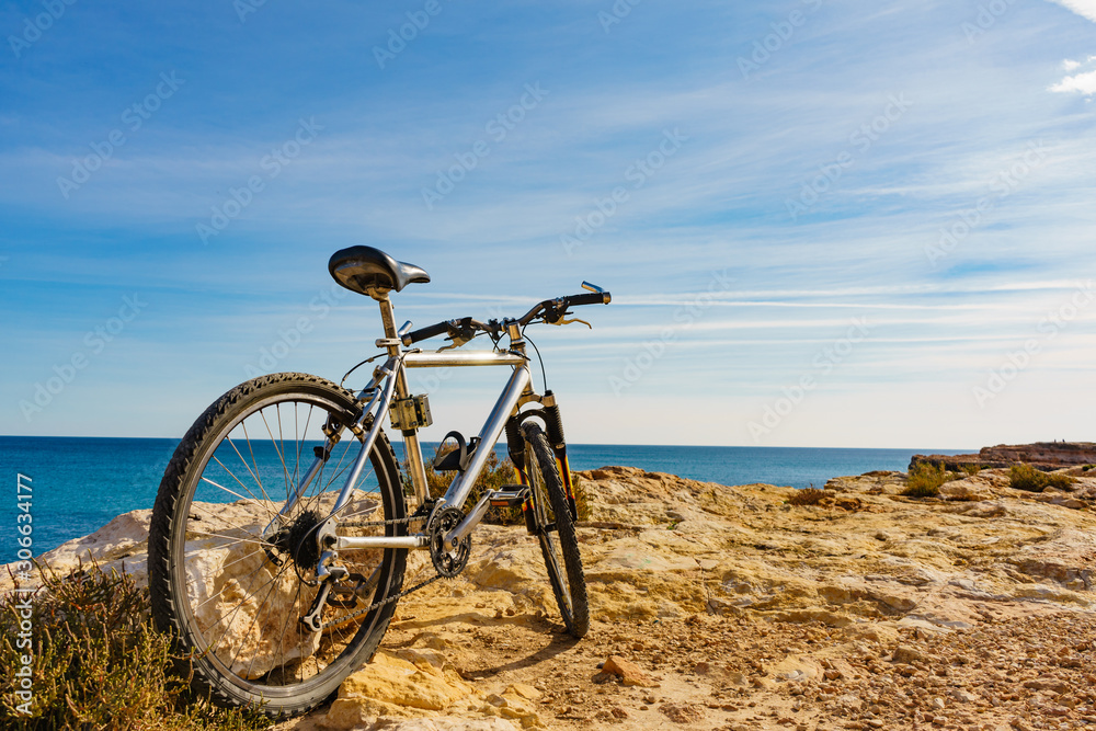 Bicycle on beach, active lifestyle.