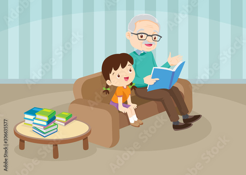 grandparents with grandchildren reading on sofa