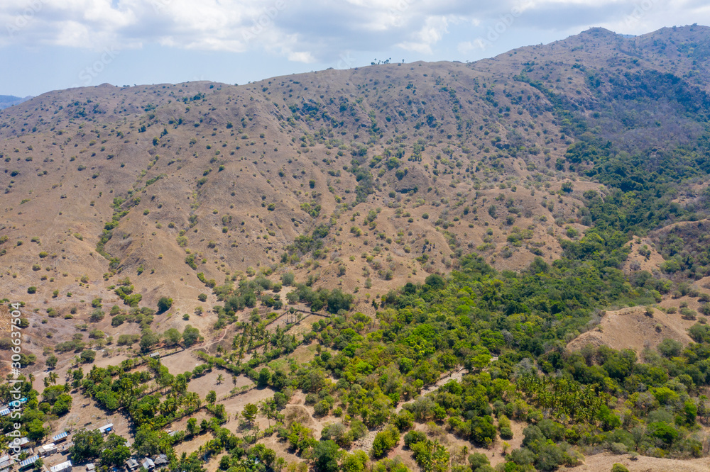 Obraz premium Aerial view of typical village on small island in Komodo National Park, Nusa Tenggara, Indonesia. Komodo National Park is home to about 3500 people.