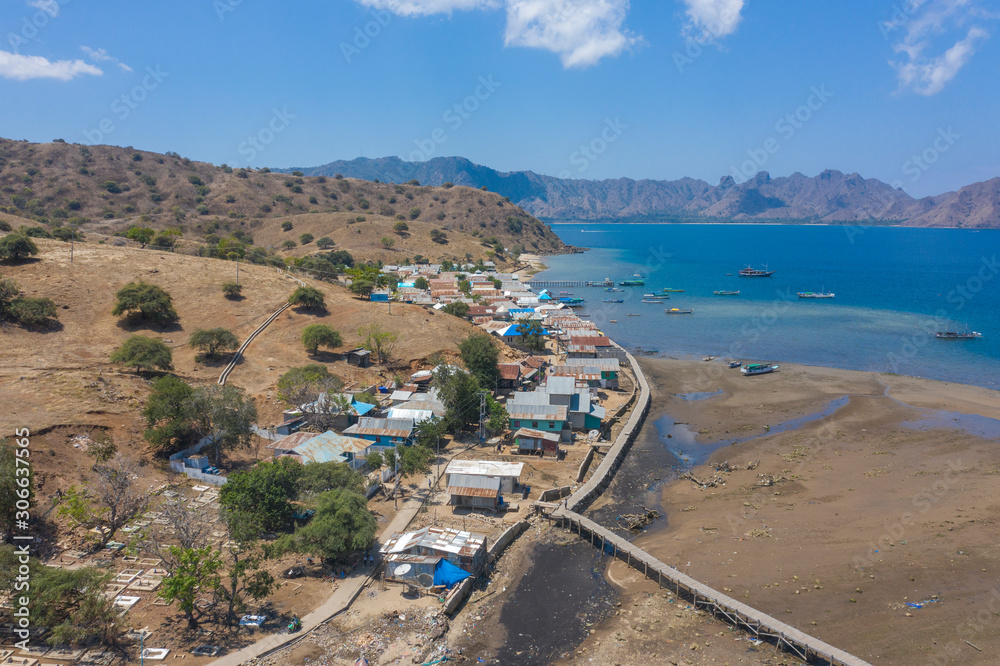 Aerial view of typical village on small island in Komodo National Park, Nusa Tenggara, Indonesia. Komodo National Park is home to about 3500 people.