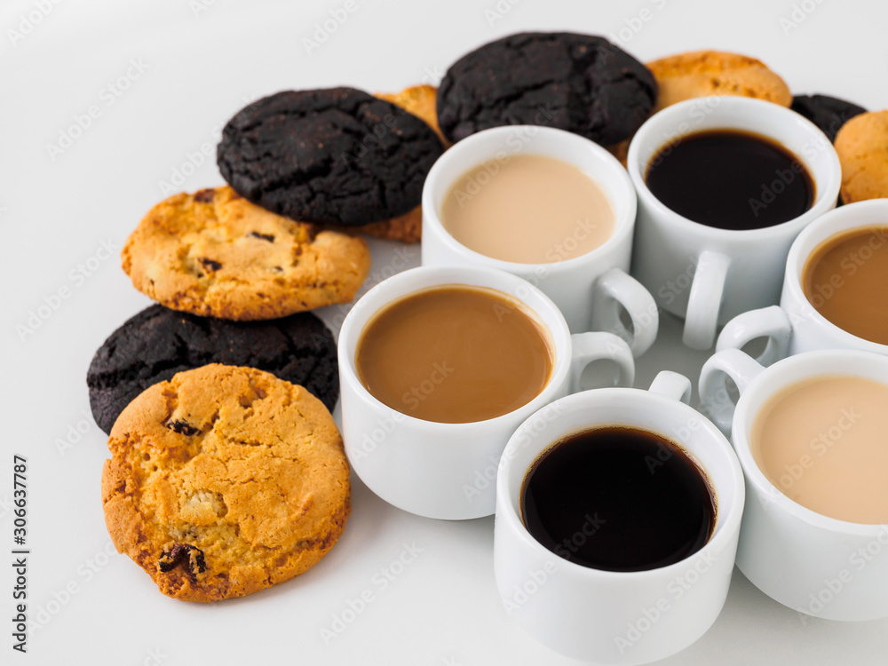 Coffee cups set in a circle and lots of sweets