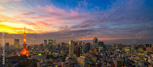 Panorama of Tokyo city skyline view and Tokyo Tower building at Japan with sunset and colorful sky. Beautiful of cloud and sky in dusk and twillight. Tokyo financial and business center zone.