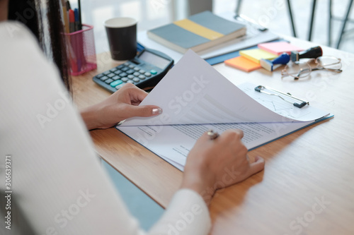 businesswoman working with document. startup woman analyzing data. student studying doing assignment photo