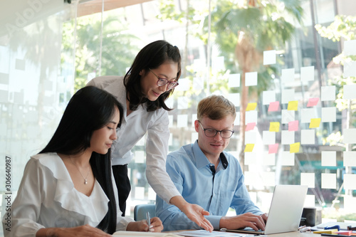 business people discussing on performance revenue in meeting. businessman working with businesswoman.