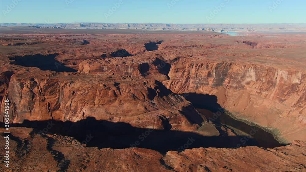 Aerial flying over Colorado River desert canyon in Page Arizona Aerial flying over Colorado River desert canyon in Page Arizona