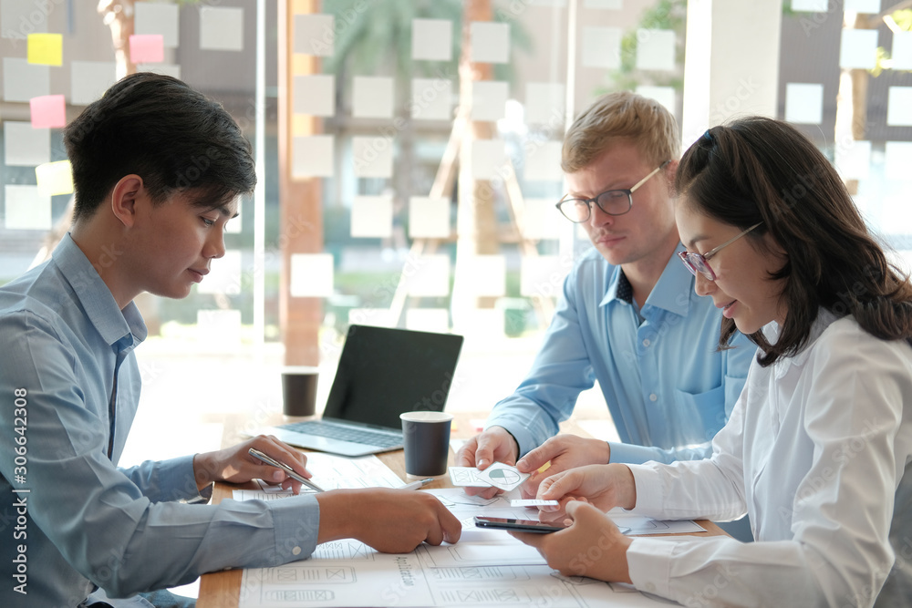 user experience UX designer designing web on smart phone layout. UI developer planning working on mobile application prototype user experience UX designer designing web on smart phone layout. UI developer planning working on mobile application prototype