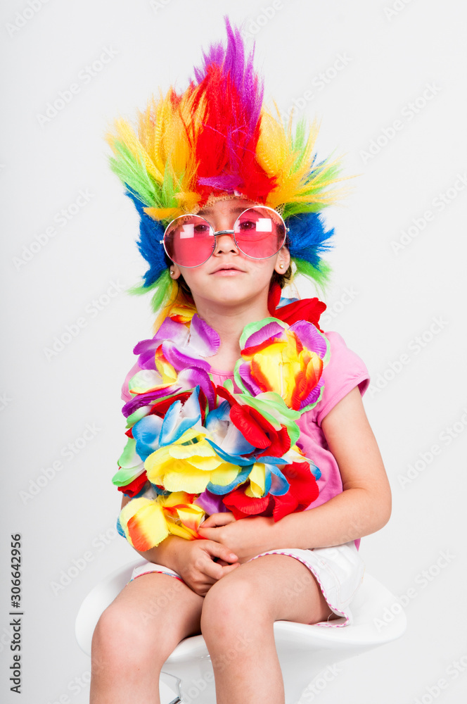Funny little girl in disguise with wig and sunglasses Funny little girl in disguise with wig and sunglasses