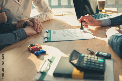 real estate agent dealer salesman using stamper for stamping approved on mortgage loan auto insurance contract agreement