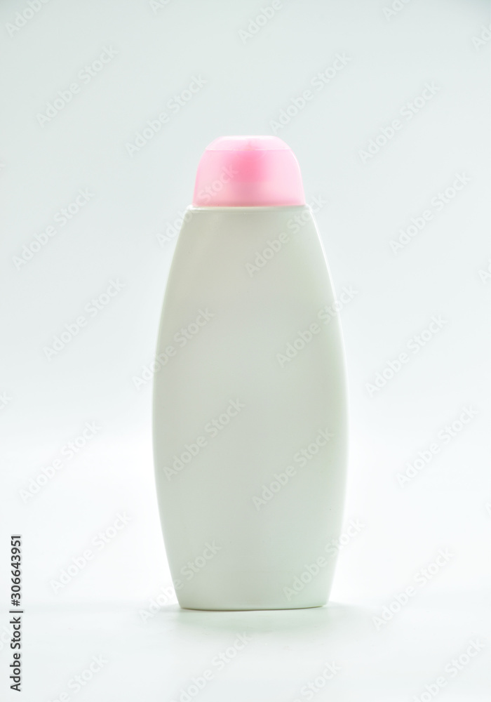White plastic bottle For lotion, body lotion on a white background. White plastic bottle For lotion, body lotion on a white background.