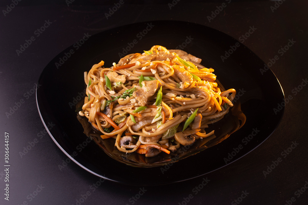noodles with beef and mushrooms on the plate noodles with beef and mushrooms on the plate