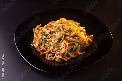 noodles with beef and mushrooms on the plate