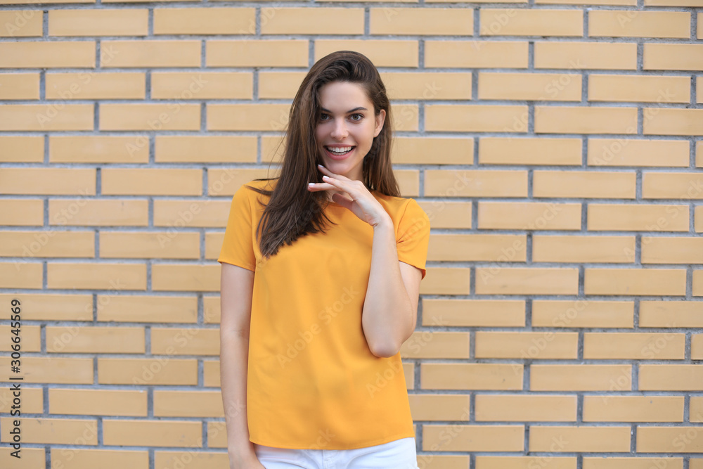Beautiful smiling brunette model dressed in summer hipster clothes. Funny and positive woman having fun. Beautiful smiling brunette model dressed in summer hipster clothes. Funny and positive woman having fun.