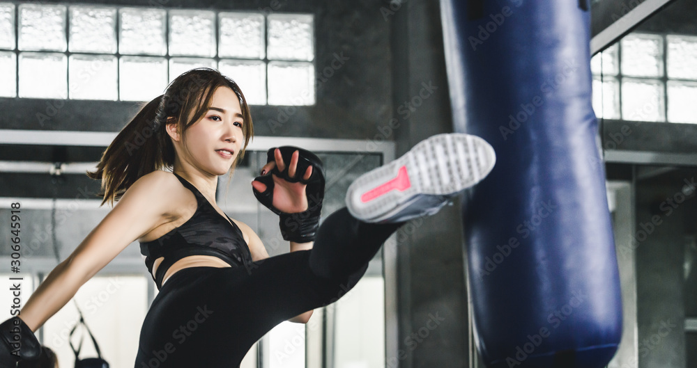 Athlete woman doing kick boxing training